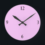 Horloge murale en rose<br><div class="desc">Cette horloge murale rose aura l'air fabuleux avec plus de coussins assortis,  servant des plateaux,  cadres d'image et interrupteurs dans ce magasin dans la même couleur rose gomme à bulles.</div>