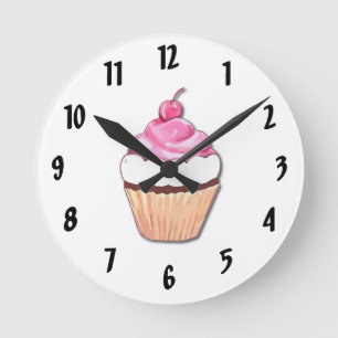 Horloge murale rose de petit gâteau