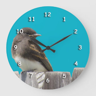 Horloge - Oiseau noir et blanc sur la clôture