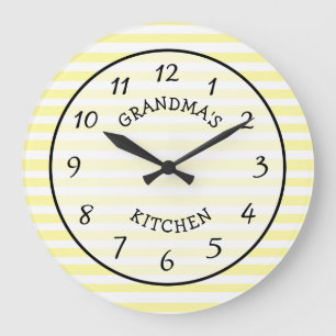 Horloge rayée jaune et blanc de la cuisine de gra