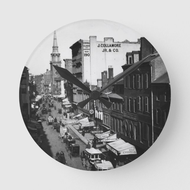 Horloge Ronde 1859 :  Le trafic et magasins sur la rue de (Recto)