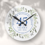 Horloge Ronde 45e anniversaire du 65e Mariage Verdure<br><div class="desc">Doté de délicats feuilles d'aquarelle douce,  ce design d'anniversaire de mariage saphir botanique chic peut être personnalisé avec vos informations spéciales d'anniversaire dans un texte élégant. Conçu par Thisisnotme©</div>