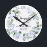 Horloge Ronde 90th Birthday Blue Rose Floral Eucalyptus Wreath<br><div class="desc">A gift or keepsake for a 90th birthday. Blue roses are nestled in green eucalyptus leaves. The name is written in beautiful calligraphy with 100th birthday and date below.</div>