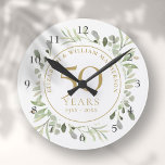 Horloge Ronde Aquarelle douce Feuilles 50e anniversaire<br><div class="desc">Doté de délicats feuilles d'aquarelle douce,  ce design botanique chic 50e anniversaire mariage peut être personnalisé avec vos informations spéciales cinquantième anniversaire dans un élégant texte en or. Conçu par Thisisnotme©</div>