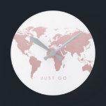 Horloge Ronde Carte du monde rose Globe<br><div class="desc">Rose doux avec un effet doré pastel rose design de carte du monde sur une horloge murale moderne minimale avec éditable "aller" citation pour vous inspirer à sortir et voir le monde ... ou comme un rappel pour sortir de la porte afin que vous puissiez être à l'heure! L'élégant globe...</div>