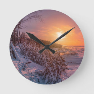 Horloge Ronde Coucher de soleil sur la côte de la mer des neiges