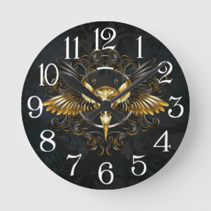 Horloge Ronde Crâne d'oiseaux dorés sur arrière - plan noir