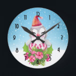 Horloge Ronde Cute Christmas Penguin in Santa Hat<br><div class="desc">A clock with a cute and whimisical design featuring an adorable penguin wearing a red santa hat. Standing behind a bouquet of flowers with pink and white striped candy canes. A snowy winter background with snowflakes falling.</div>