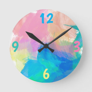 Horloge Ronde Éclaboussure de peinture bleue, verte et pêche