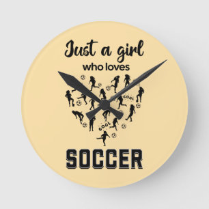 Horloge Ronde Filles en silhouette jouant au football 