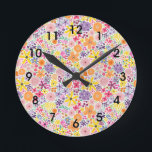 Horloge Ronde Fleurs sauvages Color Pop<br><div class="desc">Color Pop Fleurs sauvages dispose de flores d'aquarelle dessinées à la main dans des couleurs vives et joyeuses,  y compris les roses,  oranges,  violets,  jaunes,  verts. Ajoutez une pop de couleur à votre décor grâce à la décoration maison de notre collection Color Pop ! Mélanger et faire correspondre.</div>