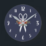 Horloge Ronde Floral Scissors<br><div class="desc">Round wall clock for a hair salon. Navy blue wall clock featuring a pair of white scissors decorated with flowers L'arrangement floral comprises flowers en rouge,  orange,  rose et blanc. With white calligraphy numbers.</div>