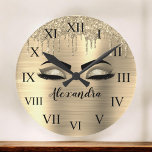 Horloge Ronde Gold Glitter Sparkle Eyelashes Monogram<br><div class="desc">Gold Faux Foil Metallic Sparkle Glitter Brushed Metal Monogram Name and Initial Eyelashes (Lashes),  Eyelash Extensions and Eyes small decorative clock. The design makes the perfect sweet 16 birthday,  wedding,  bridal shower,  anniversary,  baby shower or bachelorette party gift for someone looking for a trendy cool style.</div>