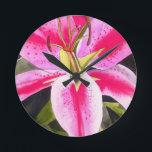 Horloge Ronde Hot pink lily Tenerife pop art watercolor flower<br><div class="desc">with original design from watercolour painting by artist Sacha Grossel of hot pink lily flower in close up,  pop art macro style. This botanical inspired floral design is very bright and colourful with intense pink petals and green background.</div>