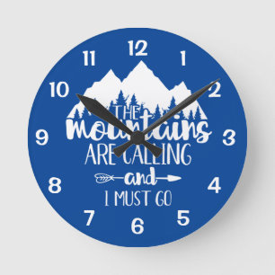 Horloge Ronde Les montagnes m'appellent et je dois partir bleu b