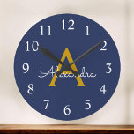 Horloge Ronde Marine Blue Gold Modern Script Girl Monogramme Nom<br><div class="desc">Navy Blue and Gold Simple Script Monogram Clock. This makes the perfect sweet 16 birthday,  wedding,  bridal shower,  anniversary,  baby shower or bachelorette party gift for someone that loves glam luxury and chic styles.</div>