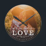 Horloge Ronde Modern Love is all you need quota Photo script<br><div class="desc">Custom modern photo clock with hand-lettered script and modern typographiy reading :'' Love is all you need ' alongside your custom names and wedding date. Personalize with your favorite photo and information. Great vend pour Newlyweds,  à anniversary ou Valentine's Day !</div>