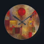 Horloge Ronde Paul Klee Ballons rouges Art coloré Abstrait<br><div class="desc">Le Ballons rouge a été peint par l'artiste Paul Klee en 1922,  montrant des formes géométriques colorées qui flottent sur la toile,  avec un ballon rouge et des formes cubistes de ville dans l'arrière - plan.</div>