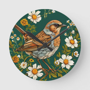 Horloge Ronde Pinson multicolore parmi des fleurs épanouies