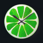 Horloge Ronde Pop art bright lime fruit original watercolour<br><div class="desc">A cute and colourful vibrant vert lime fruit slice from an original painting by artist Sacha Grossel. This large pop style fruit is green and very bright and colourful against a customisable orange coloured background. Quirky et original.</div>