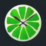Horloge Ronde Pop art bright lime fruit original watercolour<br><div class="desc">A cute and colourful vibrant vert lime fruit slice from an original painting by artist Sacha Grossel. This large pop style fruit is green and very bright and colourful against a customisable orange coloured background. Quirky et original.</div>