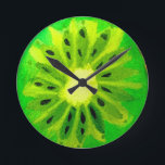 Horloge Ronde Pop art vif kiwi fruit original aquarelle<br><div class="desc">Une jolie tranche de fruits de kiwi colorée et vibrante d'un tableau original de Sacha Grossel. Ce grand fruit de style pop art est vert et très lumineux et coloré contre un arrière - plan de couleur jaune personnalisable. Excentrique et original.</div>