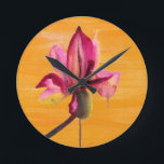 Horloge Ronde Purple Orchid watercolour orange pop art flower<br><div class="desc">From original watercolour painting by Sacha Grossel of a purple watercolour flower design on a bright orange pop art vividly coloured painted art background. This vibrant design was inspired by tropical floral climates and is a botanical meets pop art style.</div>