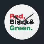 Horloge Ronde Rouge, Noir et Vert.<br><div class="desc">Rouge, Noir et Vert. Les 3 couleurs panafricaines du drapeau représentent :ROUGE: le sang qui unit tous les peuples d'ascendance africaine noire, et versé pour la libération;NOIR: les noirs dont l'existence en tant que nation, bien que non en tant qu'État-nation, est confirmée par l'existence du drapeau; et VERT : la...</div>