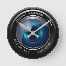 Round faced clock with SLR zoom lens