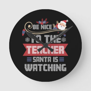 Horloge Ronde Soyez gentil avec le Père Noël de l'enseignant reg