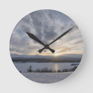 Horloge Ronde Sunset over frozen