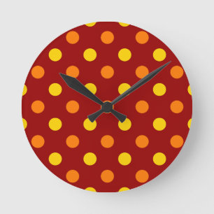 Horloge Ronde Taches orange et jaunes sur fond rouge