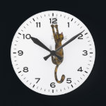 Horloge Ronde Tortoise Shell Cat Hanging<br><div class="desc">A humorous wall clock for the home or office. Tortoise shell cat hanging on with claws. Makes à l'original poison de tortie lovers. Check out of Jenn's Doodle World for even more novelty clocks and animal themed home decor.</div>