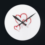 HORLOGE RONDE **TRIPLER LES COEURS** FERMER<br><div class="desc">CETTE HORLOGE EST UNE GRANDE "IDÉE DE CADEAU" POUR TOUS LES PERSONNES ET LES TEMPS AMOUREUX DANS VOTRE VIE...  OU POUR "VOUS" AUSSI!</div>