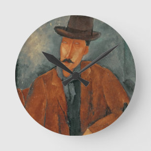 Horloge Ronde Un homme assis se penchant sur une table