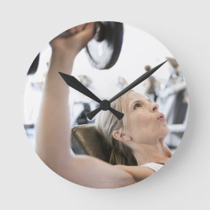 Horloge Ronde Woman Lifting Weights