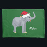 Housse D'oreillers Christmas Elephant<br><div class="desc">Ce magnifique oreiller d'éléphant de Noël présente un bel éléphant souriant portant un chapeau de Père Noël rouge avec un tronc surélevé. Cette jolie literie personnalisée est décorée d'un charmant arrière - plan de vacances vert. Personnalisez avec votre propre texte en bas pour un cadeau élégant.</div>