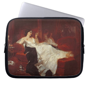 Housse Pour Ordinateur Portable Femme sur un sofa rouge