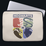 Housse Pour Ordinateur Portable Vintage HOGWARTS™ Stamped Crest<br><div class="desc">Show your house pride in bold, vintage-inspired style with this striking Hogwarts™ crest design. Featuring graphic silhouettes representing the four iconic houses — Gryffindor™, Slytherin™, Hufflepuff™, and Ravenclaw™ — this artwork blends classic symbolism with a modern, retro aesthetic. Each house emblem is set within a clean, color-blocked shield, creating a...</div>