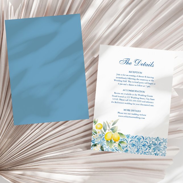Invitation Carrelage bleu italien et citron Mariage Détails C (Italian Blue Tiles and Lemons Wedding Details Card on a sunny white dry palm leaf.)