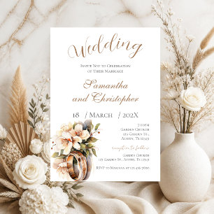 Invitation de mariage avec des anneaux et des fleu