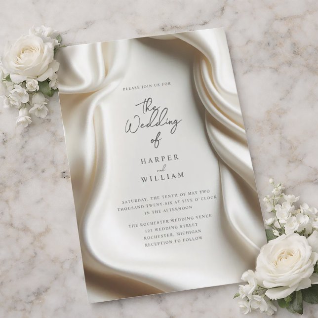 Invitation de mariage en satin blanc élégant (Elegant wedding invitation featuring a white satin frame.)