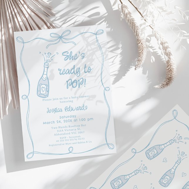 Invitation Main Bleue Whimsical Prêt À Pop Baby shower (Whimsical She's Ready To Pop Baby Shower Invitation for Boy Bow Frame Popping Champagne Bottle )
