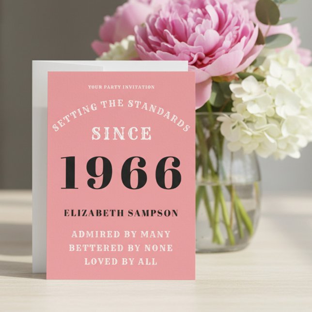 Invitation Personalized 60th Birthday 1966 Add Your Name Pink (1966 pink birthday invitation on a table with flowers.)