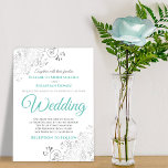Invitation Silver Filigree Aqua et White Elegant Wedding<br><div class="desc">Cette invitation de mariage simple mais élégante présente un texte de script couleur aqua, turquoise ou turquoise sur un arrière - plan blanc avec une fausse feuille argent filigree floral dans les coins. Le design est à la fois orné et simple, avec des tourbillons et des fraises sur les bords,...</div>