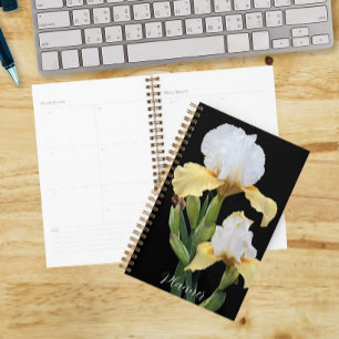 Iris blancs et jaunes sur fond floral noir