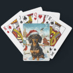 Jeu De Cartes Dachshund Winter Wonderland Christmas Joy<br><div class="desc">Ce design festif reflète l'esprit joyeux de la période des fêtes, avec un adorable petit portant un chapeau de Père Noël. Le chien est niché dans un pays des merveilles hivernales, avec un bonhomme de neige, un sapin de Noël décoré et des cadeaux joliment emballés. Les flocons de neige tombent...</div>