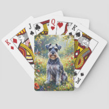 Schnauzer dans une prairie de fleurs sauvages
