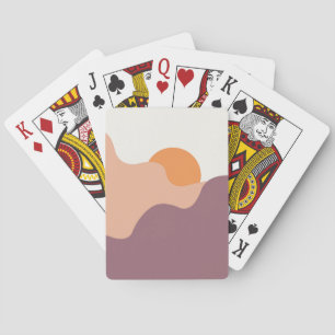 Jeu De Cartes Soleil descend derrière les collines pourpres