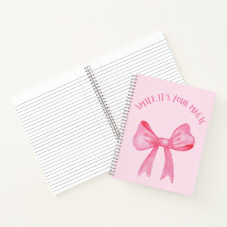 Joli carnet en spirale rose avec un arc